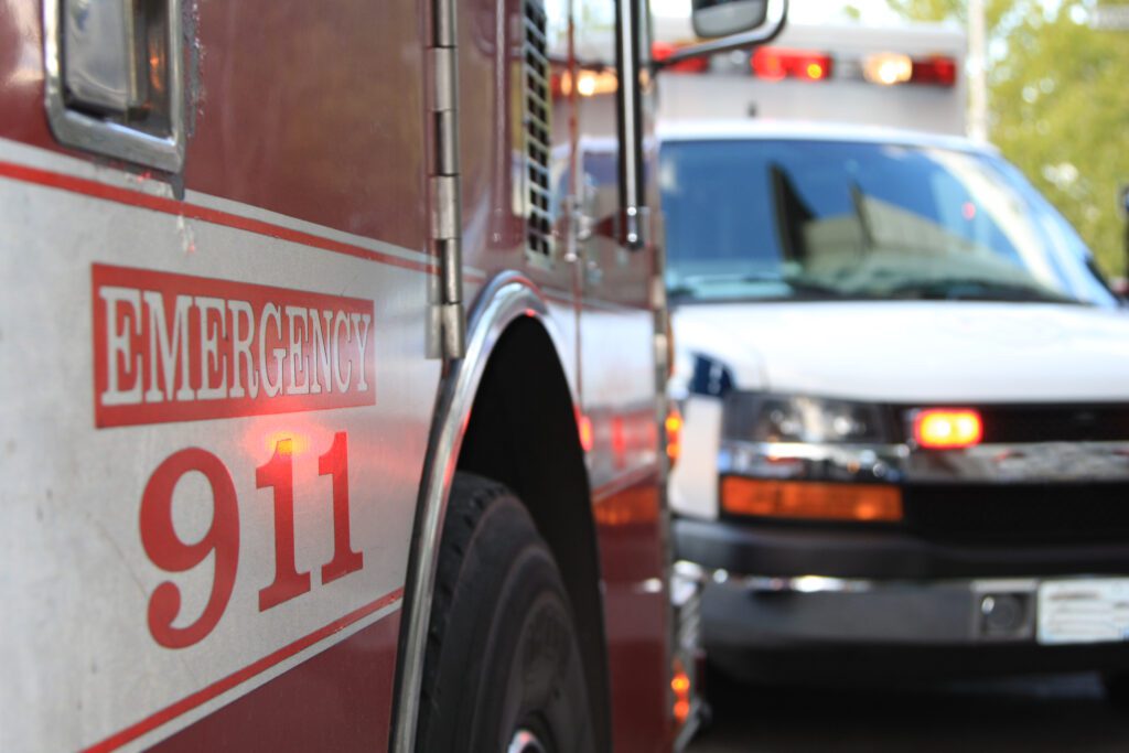 Two ambulances in a parking lot