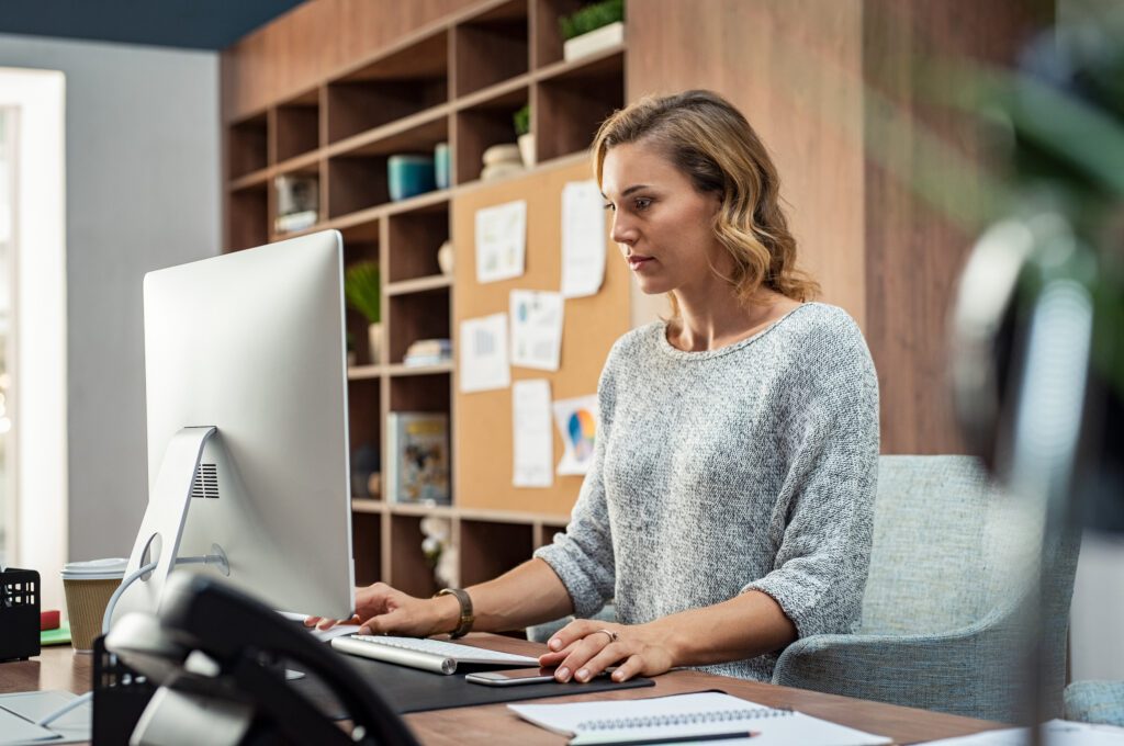 woman working at desktop computer